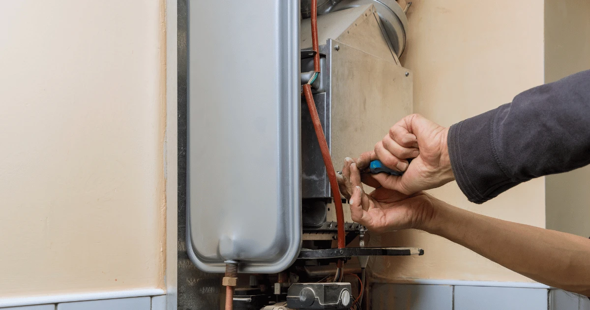 Repairman-fixing-water-heater-img